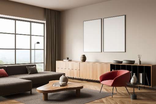 Image 2: Real wood makes living cozy and has a calming effect. The reddish splash of color armchair here makes the atmosphere very harmonious. Photo: ismagilov/iStock.com